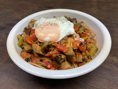 stewed-summer-vegetables-over-pasta-with-a-poached-eggs
